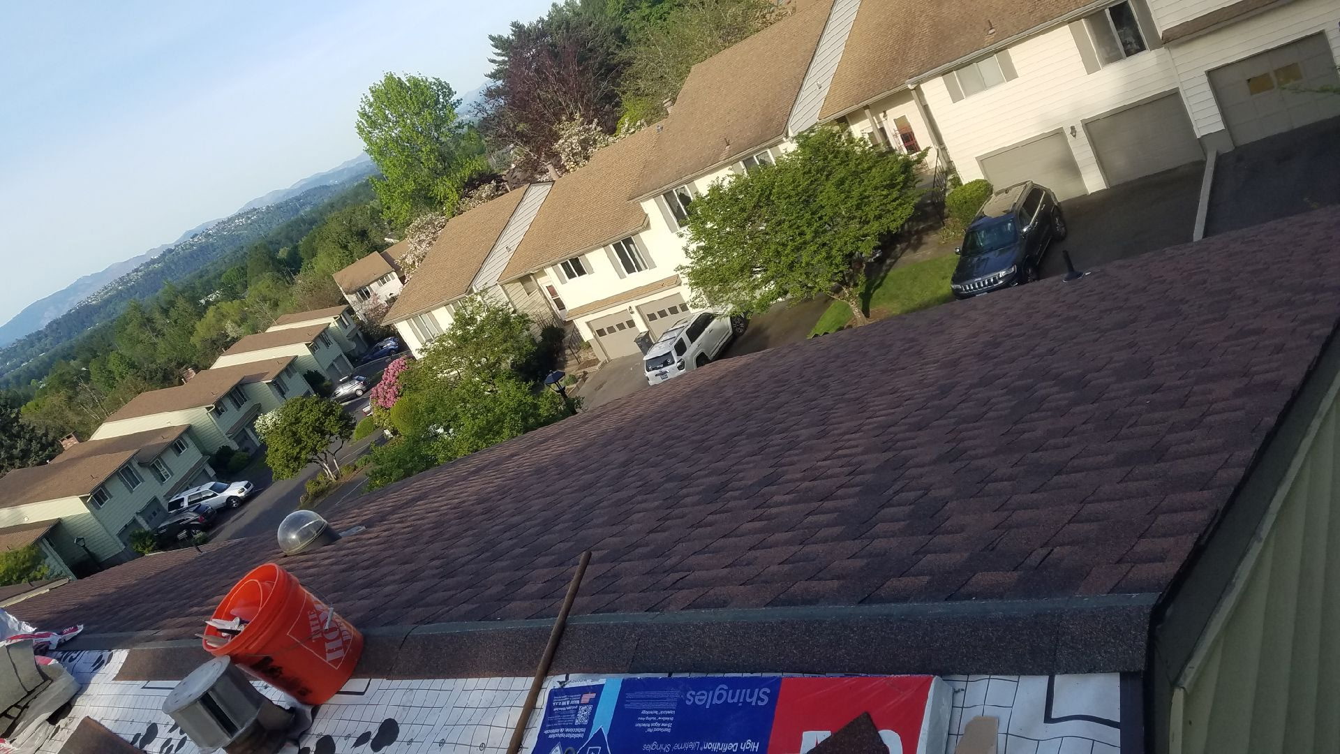 After: New brown shingles installed